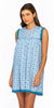 Woman wearing a blue patterned dress on a white background